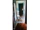 The bathroom shows bright, mismatched mosaic tiled floors from the doorway, and older fixtures at 1924 E Maryland St, Indianapolis, IN 46201