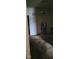Living room features vintage chandelier and worn carpeting at 1924 E Maryland St, Indianapolis, IN 46201