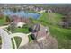 Aerial view showcases the home nestled within a community, enhanced by picturesque lake views at 1937 Knightsbridge Rd, Danville, IN 46122