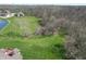 An aerial view featuring a expansive lawn adjacent to wooded area at 1937 Knightsbridge Rd, Danville, IN 46122