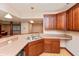 Basement bar area featuring sink, countertops and rich-toned cabinets at 1937 Knightsbridge Rd, Danville, IN 46122