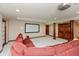 Finished basement with plush carpeting, theater screen, projector, and comfortable seating area at 1937 Knightsbridge Rd, Danville, IN 46122