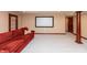 Finished basement with plush carpeting and theater screen at 1937 Knightsbridge Rd, Danville, IN 46122