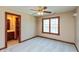 Bright bedroom with large window and view to adjacent bathroom with updated vanity at 1937 Knightsbridge Rd, Danville, IN 46122