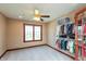 Bedroom features neutral carpet, window and a well-appointed open closet at 1937 Knightsbridge Rd, Danville, IN 46122