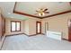 Large bedroom with coffered ceiling, large windows, and access to an outdoor patio at 1937 Knightsbridge Rd, Danville, IN 46122