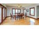 Bright dining room featuring large windows, hardwood floors, and a spacious dining table at 1937 Knightsbridge Rd, Danville, IN 46122