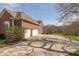 Spacious driveway leading to a three-car garage, surrounded by lush greenery and mature trees, providing ample parking at 1937 Knightsbridge Rd, Danville, IN 46122