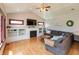 Cozy living room features a fireplace, built-in shelving, coffered ceiling, and a comfortable sectional sofa at 1937 Knightsbridge Rd, Danville, IN 46122