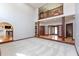 Expansive living room with a second-story overlook, hardwood floors, and multiple entryways, perfect for entertaining guests at 1937 Knightsbridge Rd, Danville, IN 46122