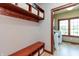 Mudroom area includes bench seating, coat rack, and storage, conveniently situated near laundry room entrance at 1937 Knightsbridge Rd, Danville, IN 46122