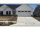Charming single-story home with a two-car garage and a well-manicured lawn at 19571 Atwater Ave, Sheridan, IN 46069