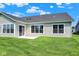 Backyard view showcasing a patio, well-maintained lawn, and the home's exterior at 19602 Atwater Ave, Sheridan, IN 46069
