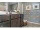 Stylish bathroom with modern vanity, patterned wallpaper, and decorative accents for a contemporary look at 19602 Atwater Ave, Sheridan, IN 46069