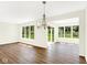 Airy dining room showcasing wood floors, abundant natural light, and access to the outdoors, creating an inviting space at 19602 Atwater Ave, Sheridan, IN 46069