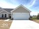 Charming one-story home with neutral siding and a spacious two-car garage at 19602 Atwater Ave, Sheridan, IN 46069