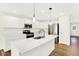 Well-lit kitchen features stainless steel appliances, an island with pendant lighting, and ample cabinet space at 19602 Atwater Ave, Sheridan, IN 46069