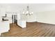 Spacious living room featuring hardwood floors and an island with stainless steel appliances at 19602 Atwater Ave, Sheridan, IN 46069