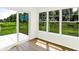 Sun-filled sunroom with sliding glass doors to the outside at 19602 Atwater Ave, Sheridan, IN 46069