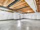 Spacious unfinished basement with open ceiling, concrete floors and partially covered walls ready for customization at 1968 Saratoga Dr, Greenwood, IN 46143