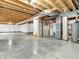 Unfinished basement with concrete floors, open ceiling and white walls provide a clean, blank canvas for storage or future renovations at 1968 Saratoga Dr, Greenwood, IN 46143