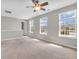 Spacious bedroom featuring a ceiling fan and large windows that allow natural light to flood the room at 1968 Saratoga Dr, Greenwood, IN 46143