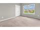Cozy bedroom featuring soft carpeting, neutral paint, and natural light at 1968 Saratoga Dr, Greenwood, IN 46143