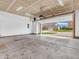 Attached garage with open door provides ample parking and leads to exterior view of home and front yard at 1968 Saratoga Dr, Greenwood, IN 46143