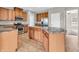 Well-lit kitchen with stainless steel appliances, a kitchen island, tile floors, and ample cabinet space at 1968 Saratoga Dr, Greenwood, IN 46143