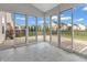 Bright sunroom with sliding glass doors offers views of the backyard and access to the deck at 1968 Saratoga Dr, Greenwood, IN 46143