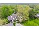 Aerial view of home with patio featuring a fireplace, pool, and lounge seating at 1995 W 116Th St, Carmel, IN 46032
