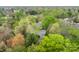 Picturesque aerial view of home surrounded by lush greenery and landscaping at 1995 W 116Th St, Carmel, IN 46032