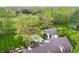 Modern home with a gabled addition and a patio with built in grill and pool at 1995 W 116Th St, Carmel, IN 46032