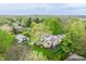 Aerial view of house and yard with patio, lounge, in a lushly landscaped neighborhood at 1995 W 116Th St, Carmel, IN 46032