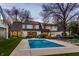 This house has a beautiful pool, patio, poolhouse and backyard with lawn at 1995 W 116Th St, Carmel, IN 46032