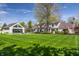 Backyard with pool, patio, and lush landscaping, offering a relaxing outdoor living space at 1995 W 116Th St, Carmel, IN 46032