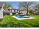 Backyard view of home with a swimming pool and lounge area, perfect for outdoor entertaining at 1995 W 116Th St, Carmel, IN 46032