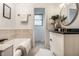 Bright bathroom featuring a soaking tub and modern vanity with decoratively tiled walls at 1995 W 116Th St, Carmel, IN 46032