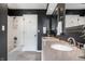 Bathroom with tiled shower/tub combination and double vanity featuring granite countertops at 1995 W 116Th St, Carmel, IN 46032