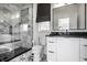 Contemporary bathroom features a marble walk-in shower and modern vanity at 1995 W 116Th St, Carmel, IN 46032