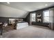 Modern bedroom features two windows, plush carpet, a queen bed and minimalist design at 1995 W 116Th St, Carmel, IN 46032