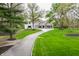 Exterior view of home with long drive and large front yard at 1995 W 116Th St, Carmel, IN 46032