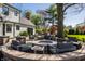 Paver patio with outdoor fire pit and comfortable seating, ideal for entertaining at 1995 W 116Th St, Carmel, IN 46032