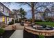 The brick patio has a built-in fire pit and comfortable seating for cozy evenings outdoors at 1995 W 116Th St, Carmel, IN 46032