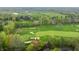 Scenic aerial shot highlighting a golf course with verdant greens and residential properties in a picturesque setting at 1995 W 116Th St, Carmel, IN 46032