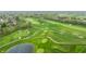 Overhead capture of the golf course showcasing the beautiful green expanse, sand traps, and paths winding through the course at 1995 W 116Th St, Carmel, IN 46032