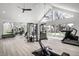 Bright home gym features work out equipment, large mirror, and great natural light at 1995 W 116Th St, Carmel, IN 46032