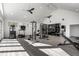 Spacious, naturally lit home gym with workout equipment and ample open floor space at 1995 W 116Th St, Carmel, IN 46032