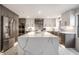 Contemporary kitchen featuring stainless steel appliances and a large quartz island at 1995 W 116Th St, Carmel, IN 46032