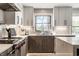Modern kitchen features stainless steel appliances, a gas range, and ample counter space at 1995 W 116Th St, Carmel, IN 46032